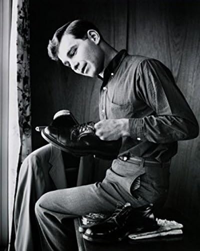 Posterazzi Side profile of a teenage boy polishing his shoes Poster Print, (18 x 24)