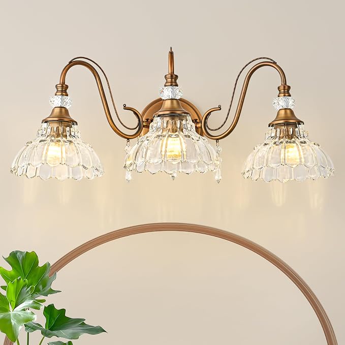 Vintage Bathroom Vanity Light, 3-Light Matte Antique Brass Finish Wall Sconce with Hanging Crystal Accents and Flower-Shaped Clear Glass Shades, Retro Wall Mount Vanity Light Over Mirror for Bathroom